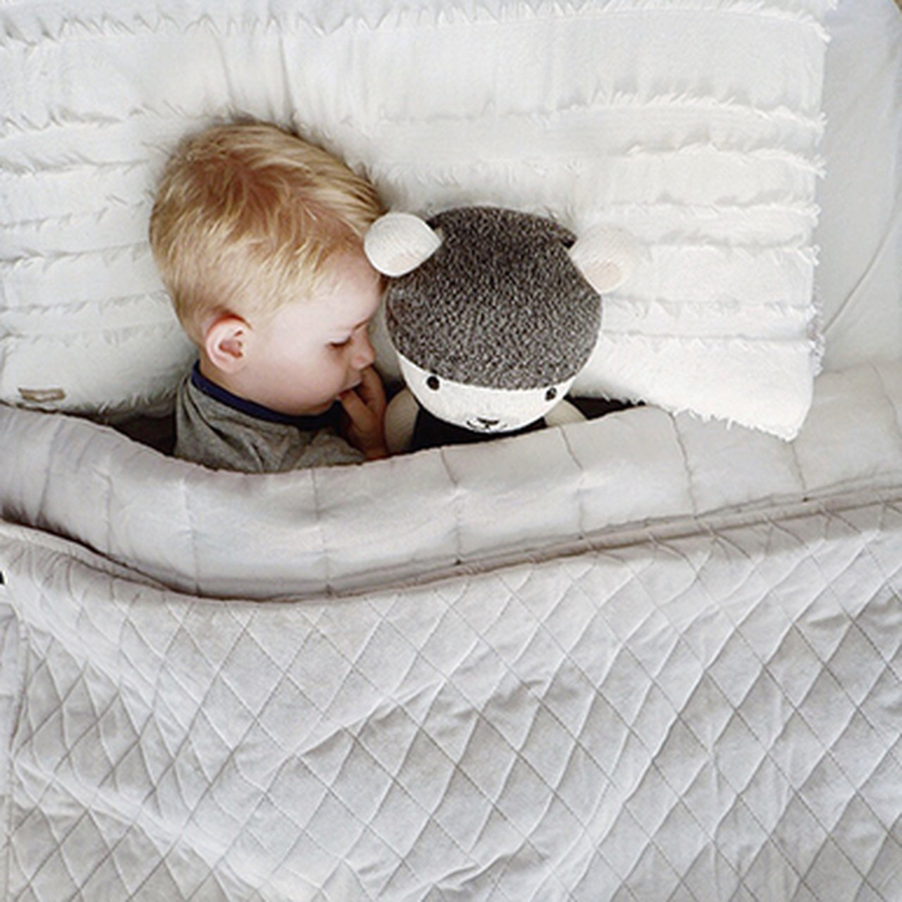Child using neptune gravity blanket